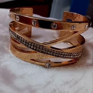 Gold wrap bangel around bracelets
